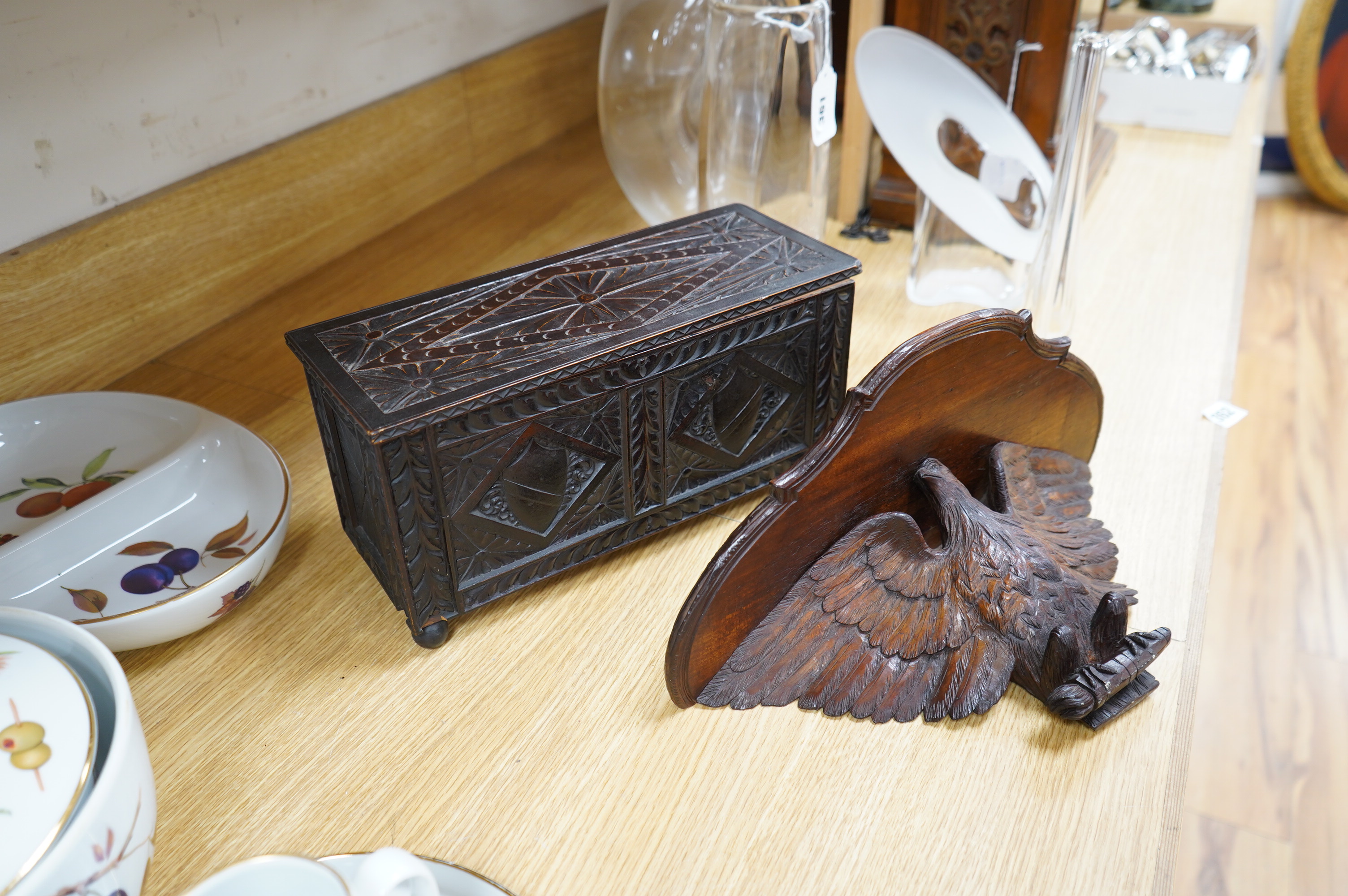 A late 19th century carved walnut and beech eagle wall bracket and a miniature coffer, largest 37cm wide. Condition - fair